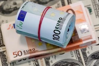 Впервые за 20 лет евро стал дешевле доллара: в чем причина
